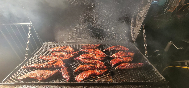 Ribs in a smoker at Terrell's Eat the Bone Barbecue in Monee, Illinois