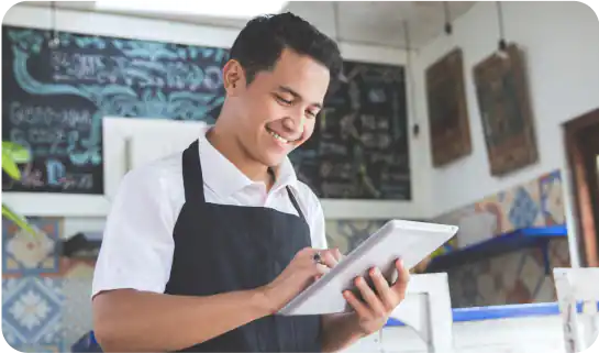 shop owner looking at tablet device